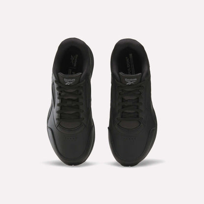 A pair of black Men's Walk Ultra 7 DMX Max Shoes - Wide 4E by Reebok is shown from above, highlighting the laces, toe area, and Reebok branding on the tongues, set against a plain white background. These wide-fit walking shoes are equipped with DMX cushioning for added comfort and support.