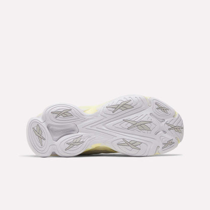 The image displays the bottom view of the Reebok Women's DMX Series 3000 Training Shoes, showcasing a white and light gray rubber outsole with multiple textured grooves and patterns for enhanced traction. This sole design is characteristic of Reebok's DMX 3 Technology, which provides added comfort and support for those seeking cushioned training footwear.