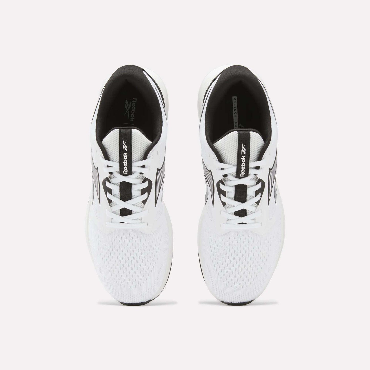 Top view of a pair of Reebok Men's Nanoflex 2 Training Shoes in white with black accents on a plain light background. These shoes feature breathable mesh uppers and visible Reebok branding on the tongues and sides.
