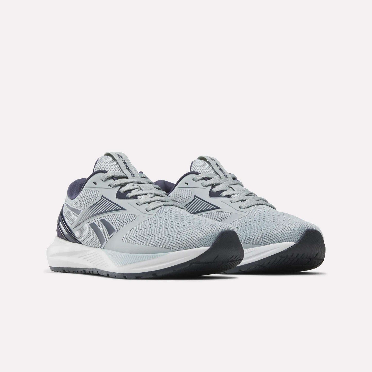 A pair of Reebok Women's NFX Trainer 2 Training Shoes in light gray with dark blue accents and white soles, displayed side by side on a plain white background.