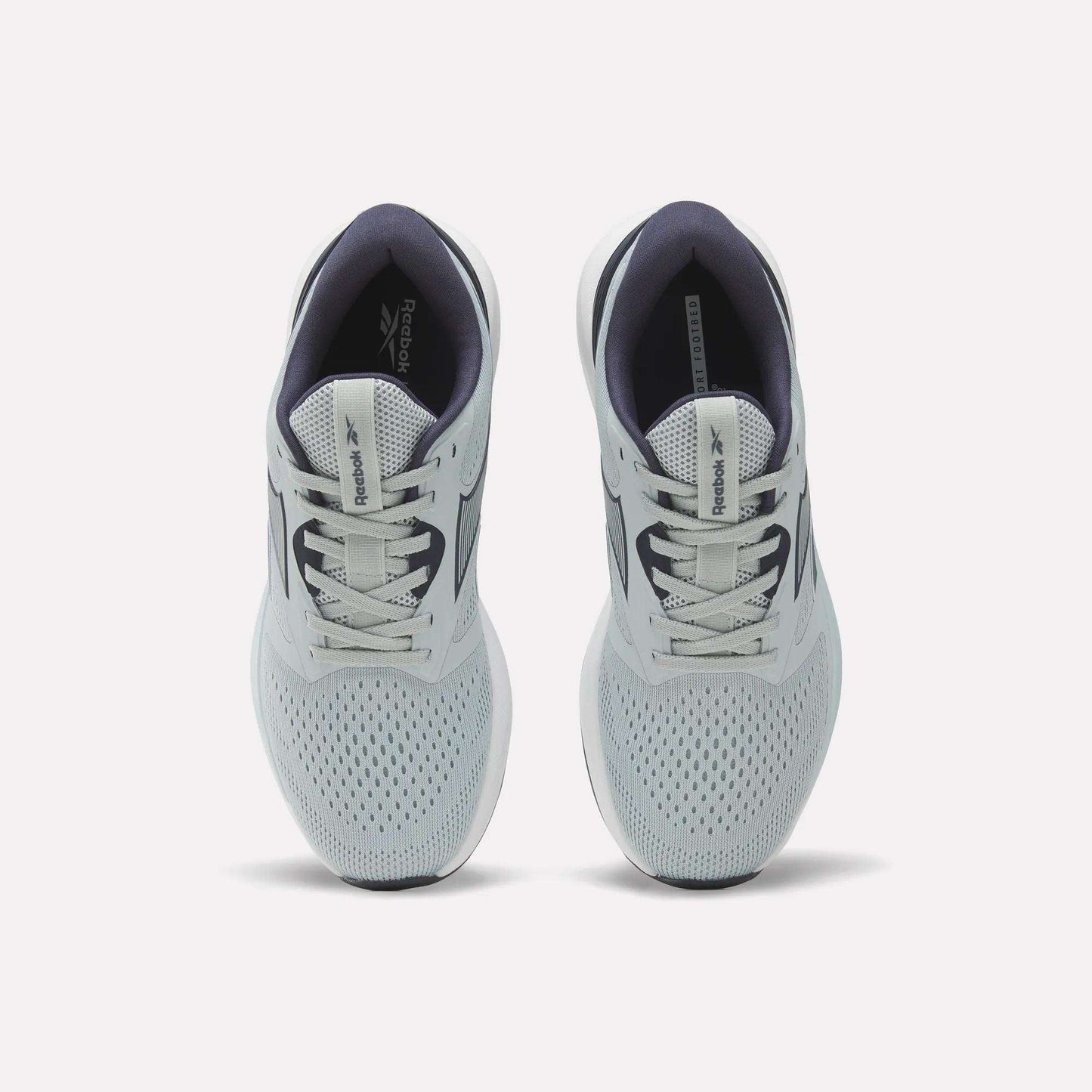 A pair of Women's NFX Trainer 2 Training Shoes by Reebok in light gray, featuring white laces, mesh uppers, and dark gray interiors, viewed from above.