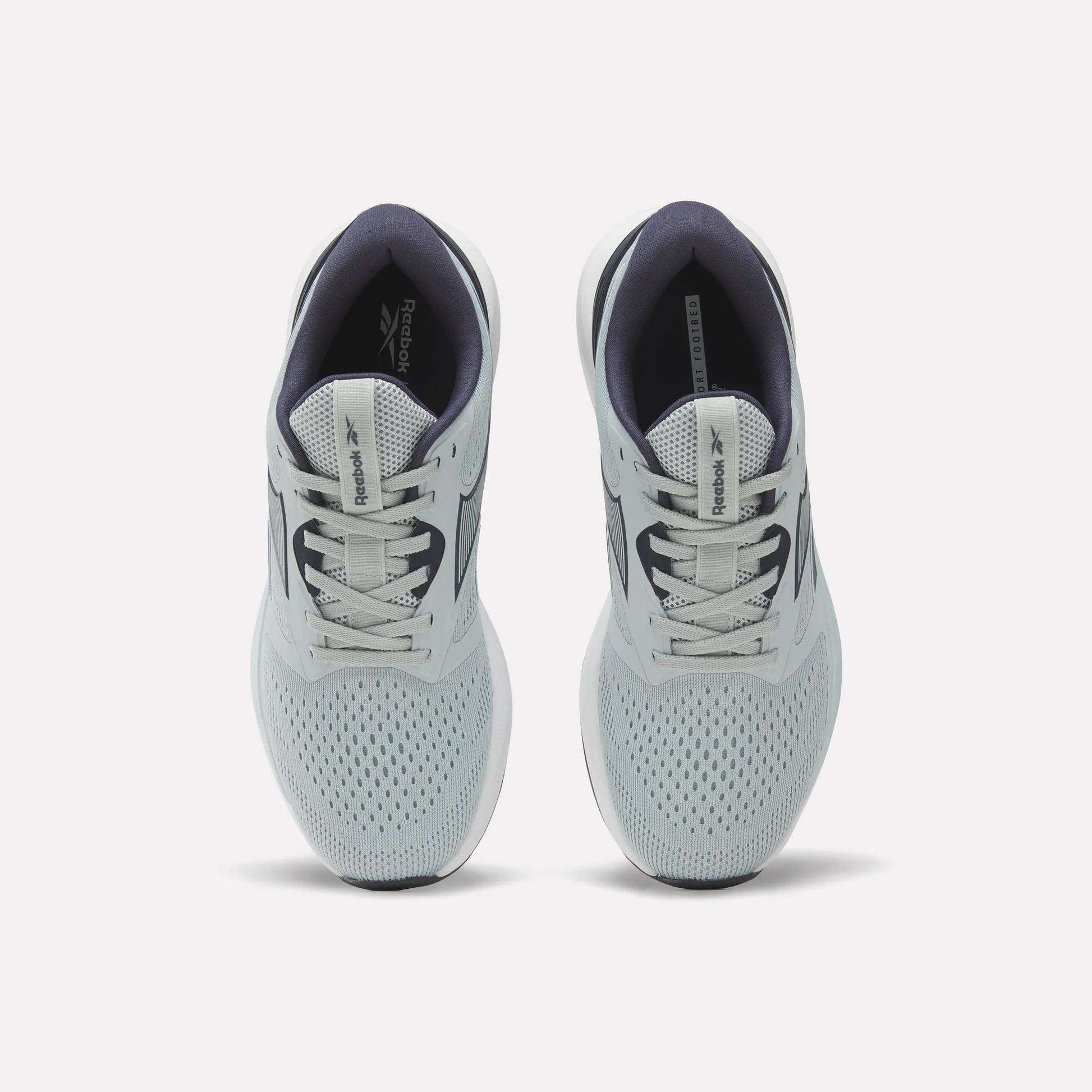 A pair of Women's NFX Trainer 2 Training Shoes by Reebok in light gray, featuring white laces, mesh uppers, and dark gray interiors, viewed from above.