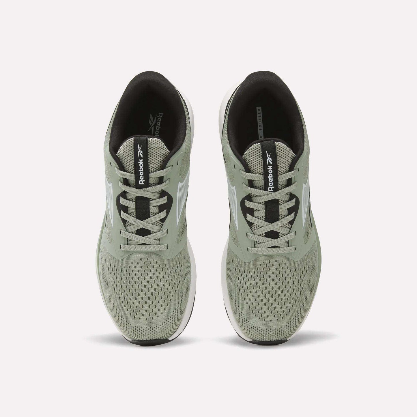 A pair of light green Reebok Men's Nanoflex 2 Training Shoes is shown from above, highlighting the laces, breathable mesh uppers, and black insoles featuring Reebok branding.