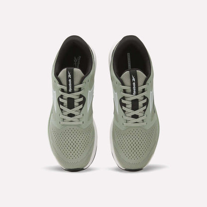 A pair of light green Reebok Men's Nanoflex 2 Training Shoes is shown from above, highlighting the laces, breathable mesh uppers, and black insoles featuring Reebok branding.