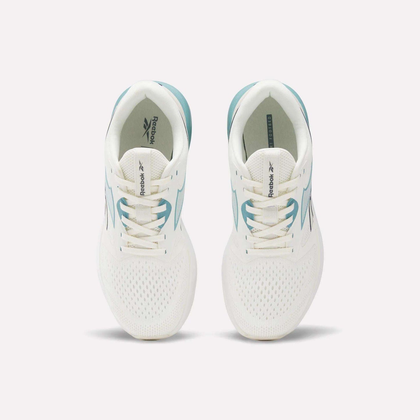 A pair of Reebok Women's Nanoflex 2.0 Training Shoes in white with teal accents, shown from above. These versatile workout shoes feature lace-up fronts and display the Reebok logo on the tongues and insoles.