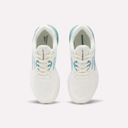 A pair of Reebok Women's Nanoflex 2.0 Training Shoes in white with teal accents, shown from above. These versatile workout shoes feature lace-up fronts and display the Reebok logo on the tongues and insoles.