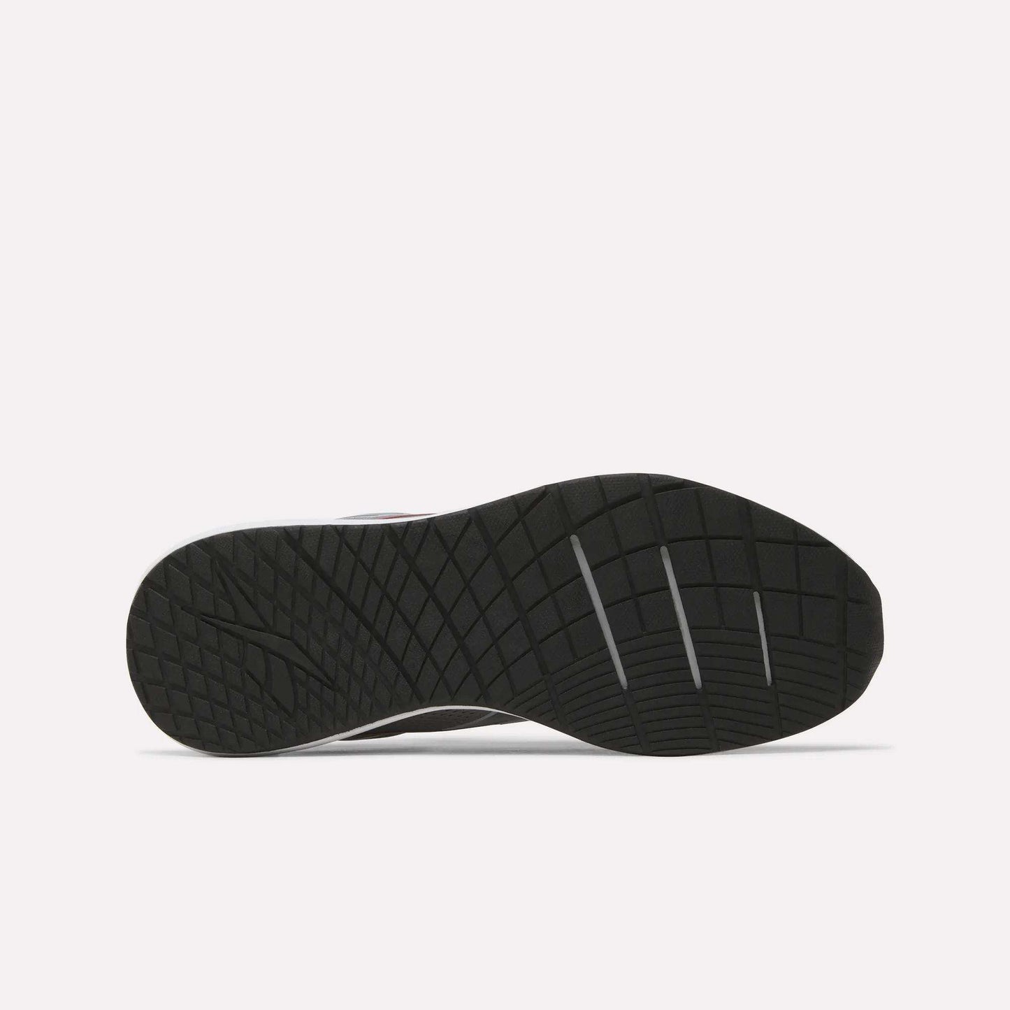 The image displays the black rubber outsole of the Men's Nanoflex 2 Training Shoes by Reebok, featuring a geometric traction pattern and three deep horizontal grooves for enhanced flexibility. The background is plain white.
