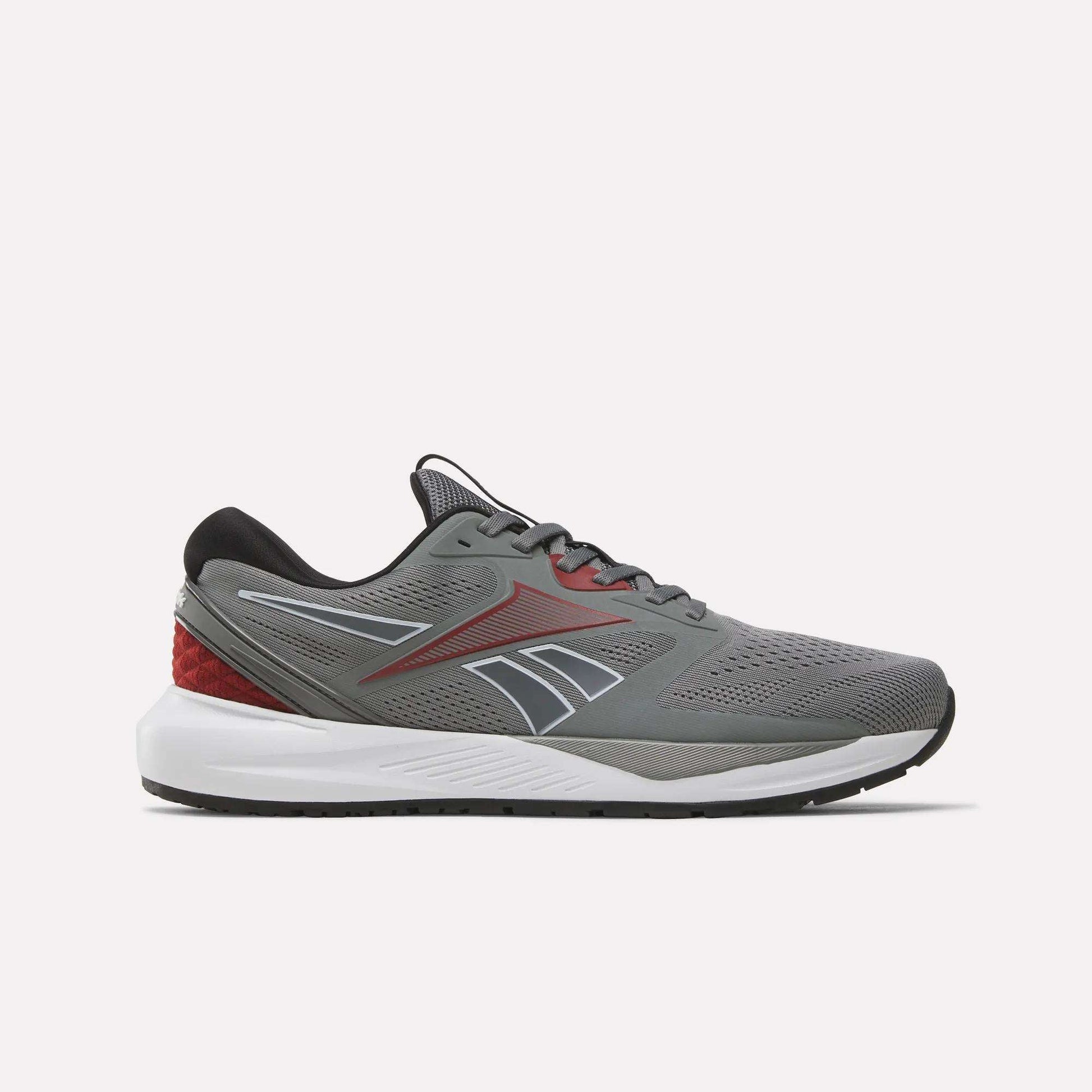 A side-profile view of the Reebok Men's Nanoflex 2 Training Shoes in Grey 4, Black, and Heritage Red, featuring black laces, red accents, a white sole, and breathable mesh construction for optimal comfort—displayed against a plain light background.