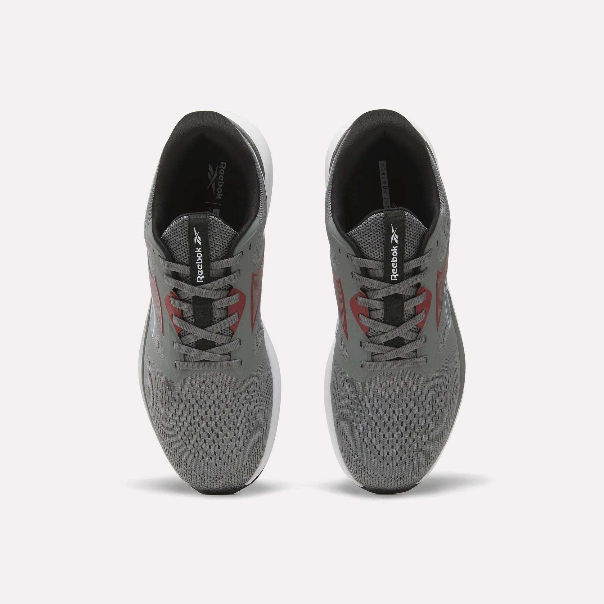 A pair of gray Reebok Men's Nanoflex 2 Training Shoes viewed from above, featuring black interiors, white soles, and red accents on the sides, with Reebok branding on the tongues. These athletic shoes are designed with breathable mesh for enhanced comfort during intense training sessions.