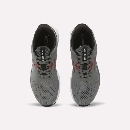 A pair of gray Reebok Men's Nanoflex 2 Training Shoes viewed from above, featuring black interiors, white soles, and red accents on the sides, with Reebok branding on the tongues. These athletic shoes are designed with breathable mesh for enhanced comfort during intense training sessions.