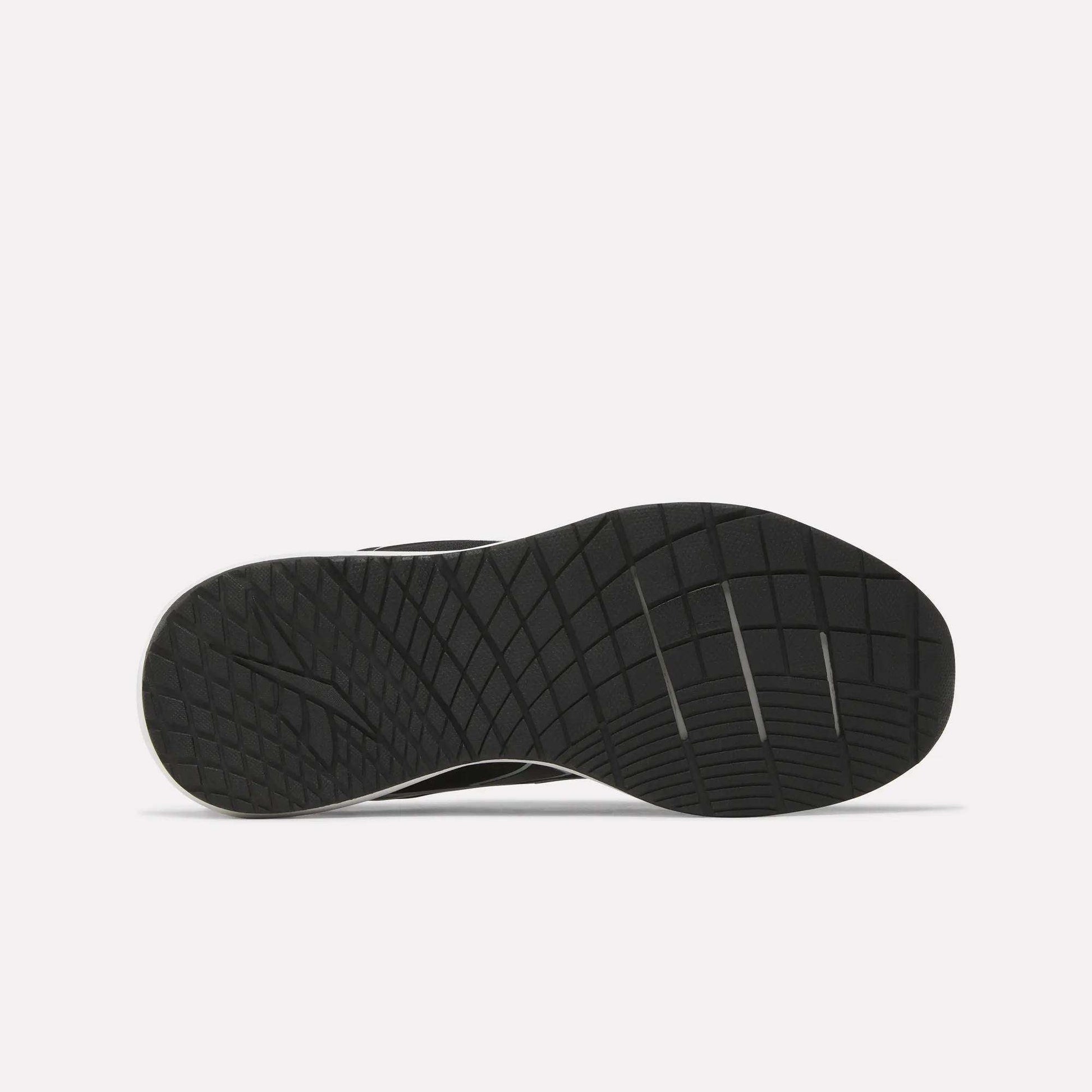 The sole of the Reebok Women's NFX Trainer 2 Training Shoes is shown from the bottom, displaying a textured pattern with geometric lines and grooves for enhanced traction against a plain white background.