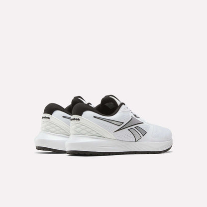 A pair of white Women's Nanoflex 2.0 Training Shoes by Reebok with black accents and a black sole, shown against a light background at an angle highlighting the side and back views.