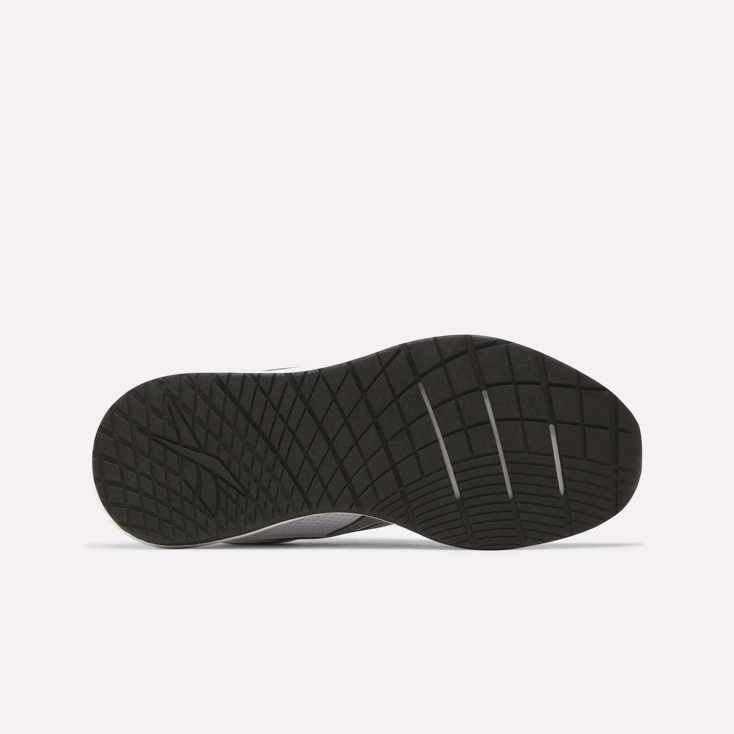 The image displays the black rubber outsole of the Reebok Women's Nanoflex 2.0 Training Shoes, featuring a geometric tread pattern, as seen from the bottom against a plain white background.