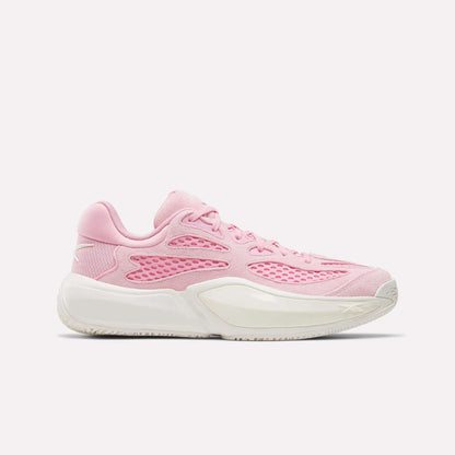 The Reebok Engine A 26 Basketball Shoes in Expressive Pink/Chalk feature mesh and synthetic overlays for stability and energy return, with a white midsole and textured outsole, shown in a side profile on a plain white background.