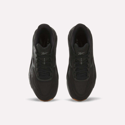 Top view of Reebok Nano Gym 2.0 Training Shoes in black with black laces, subtle logo on the tongue, and high-rebound foam cushioning, displayed on a plain white background.