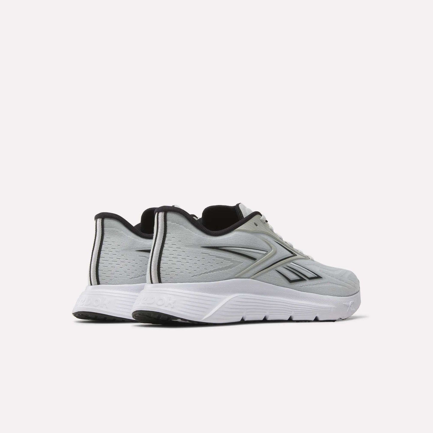 A pair of light gray Reebok Nano Gym 2.0 Training Shoes with white soles and black accents, featuring the Reebok logo on the side, displayed at an angle highlighting the outer sides and back.