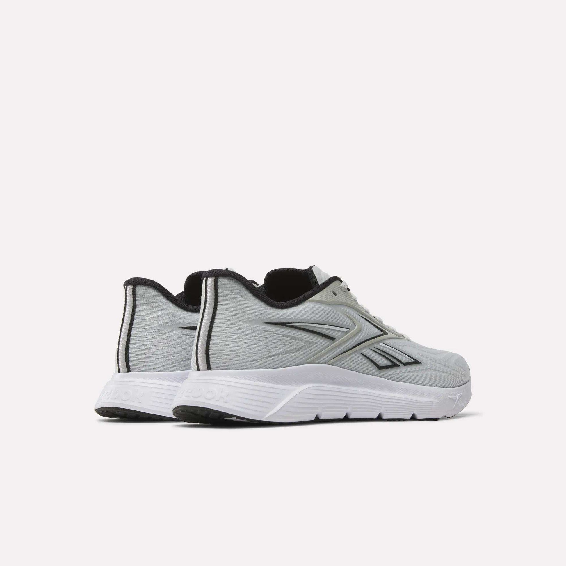 A pair of light gray Reebok Nano Gym 2.0 Training Shoes with white soles and black accents, featuring the Reebok logo on the side, displayed at an angle highlighting the outer sides and back.