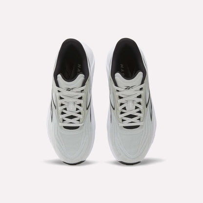 A top view of Reebok Nano Gym 2.0 Training Shoes shows a white pair with black accents, white laces, a slightly chunky silhouette, and a comfortable black interior.