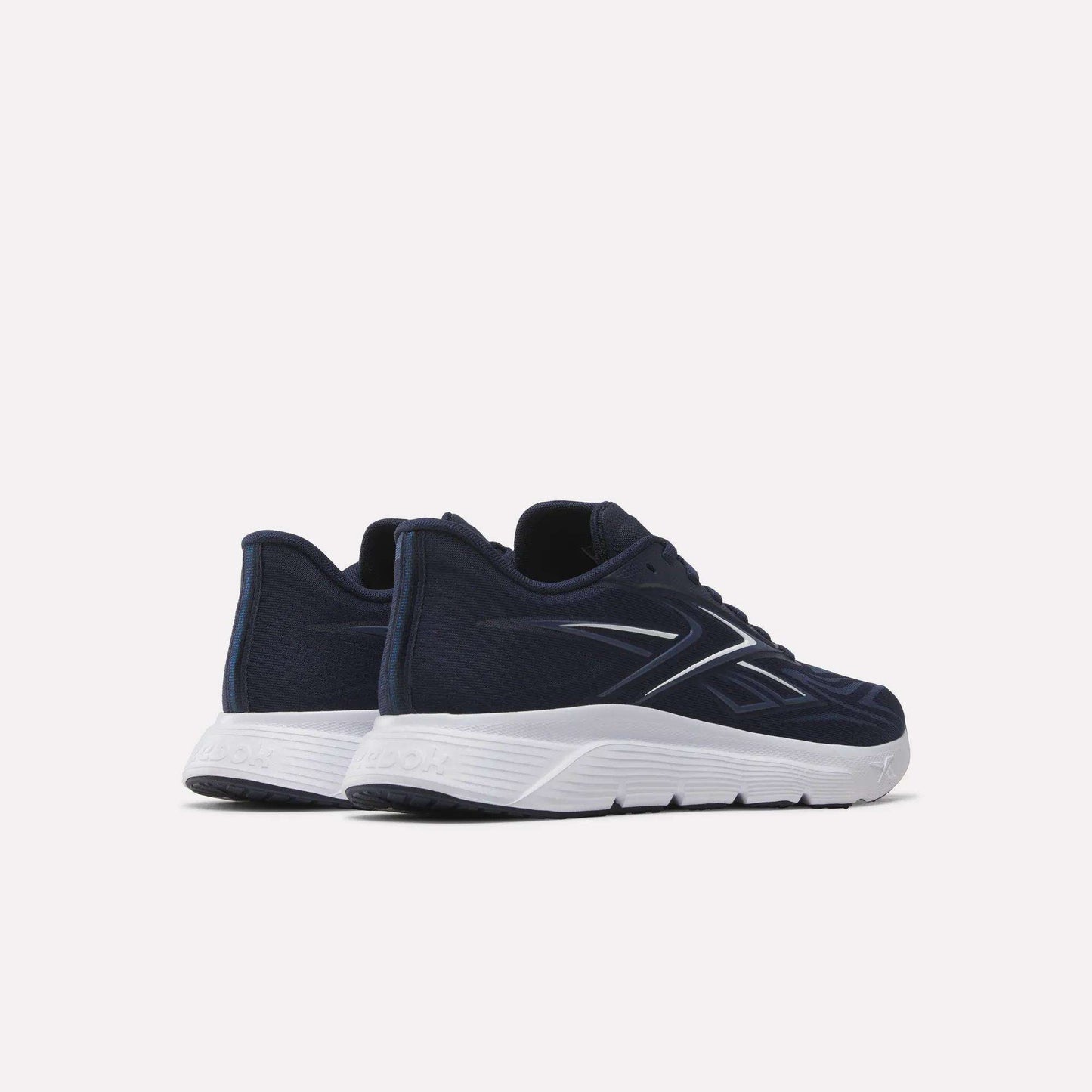 A pair of dark blue Reebok Nano Gym 2.0 Training Shoes with white soles, shown from the back and side on a light background. These sneakers have a sleek, modern design with a subtle logo.