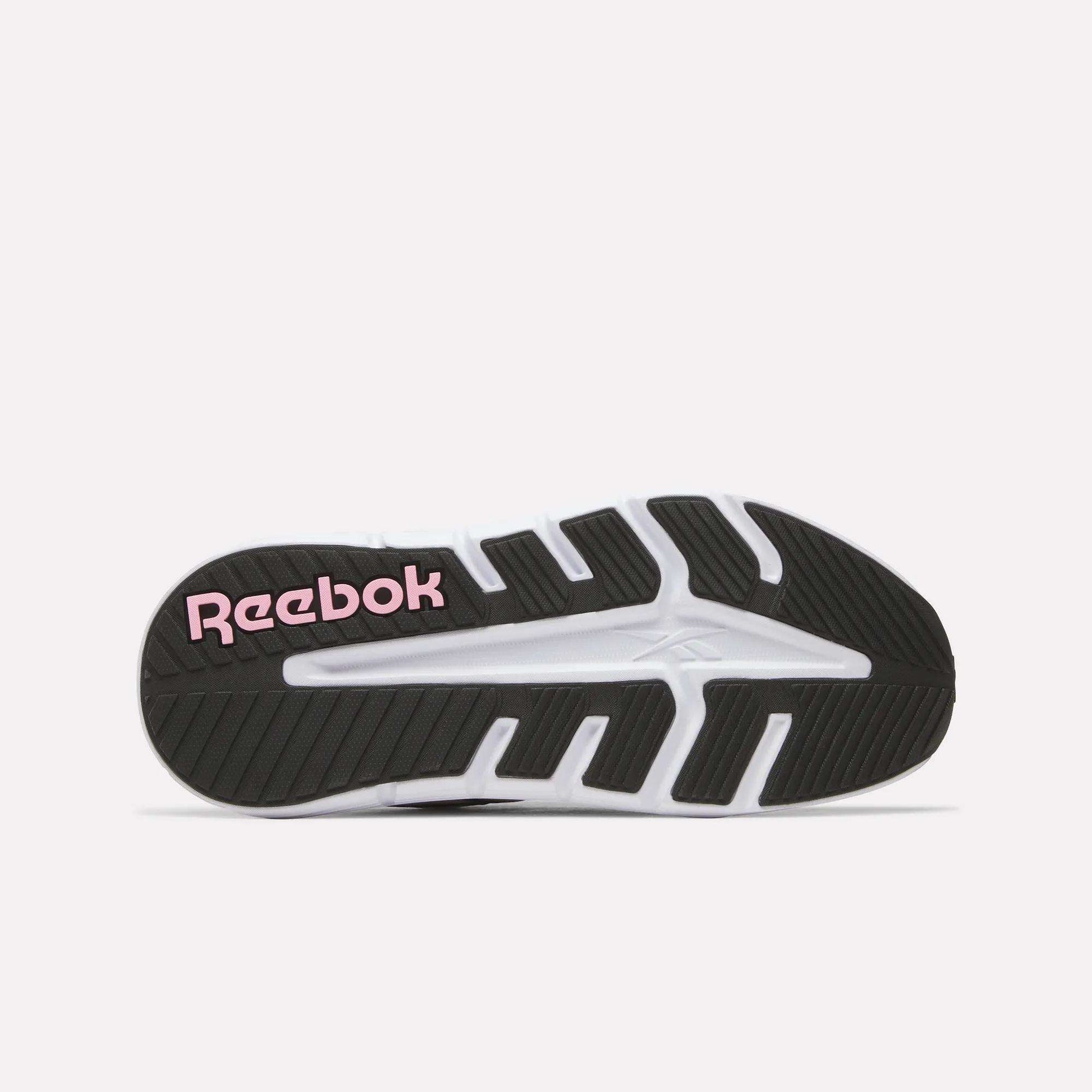 The Women's Nano Gym 2.0 Training Shoes by Reebok have a black and white tread pattern on the sole, with "Reebok" in pink lettering near the heel.