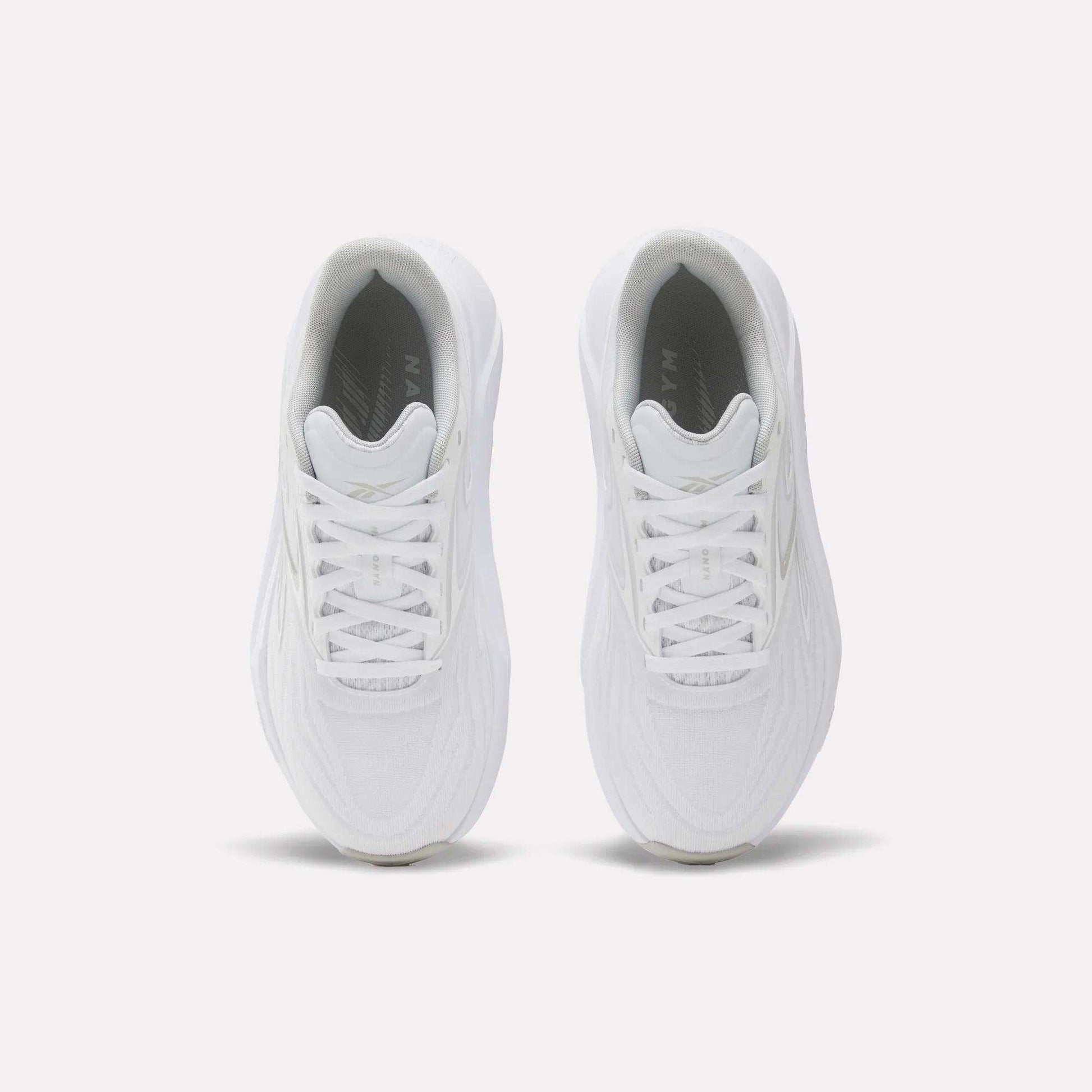 The Reebok Women's Nano Gym 2.0 Training Shoes are shown from above, featuring white laces and textured uppers against a plain white background—ideal for versatile workouts.