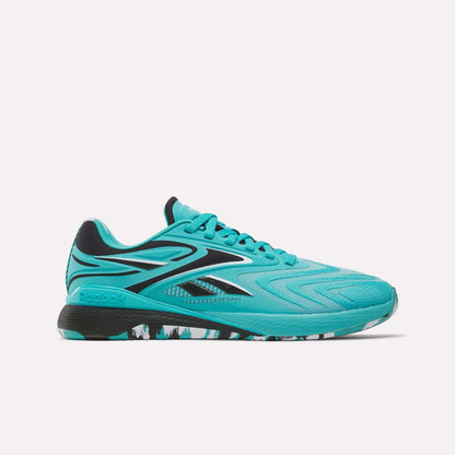 The Women's Nano X5 Edge Training Shoes by Reebok feature a vibrant turquoise color with black accents, geometric design, and a black-and-white cushioned sole—ideal for HIIT workouts. Shown against a plain white background.