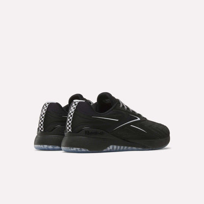 A pair of Reebok Nano X5 Edge Training Shoes in black with white accents, checkered rear pattern, and translucent soles are displayed from an angled rear view on a plain white background for a performance-ready look.