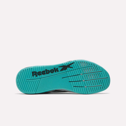 The image shows the teal sole of Reebok Nano X5 Edge Training Shoes with black Reebok logo and vector, featuring horizontal and diagonal grooves for traction on a plain white background.