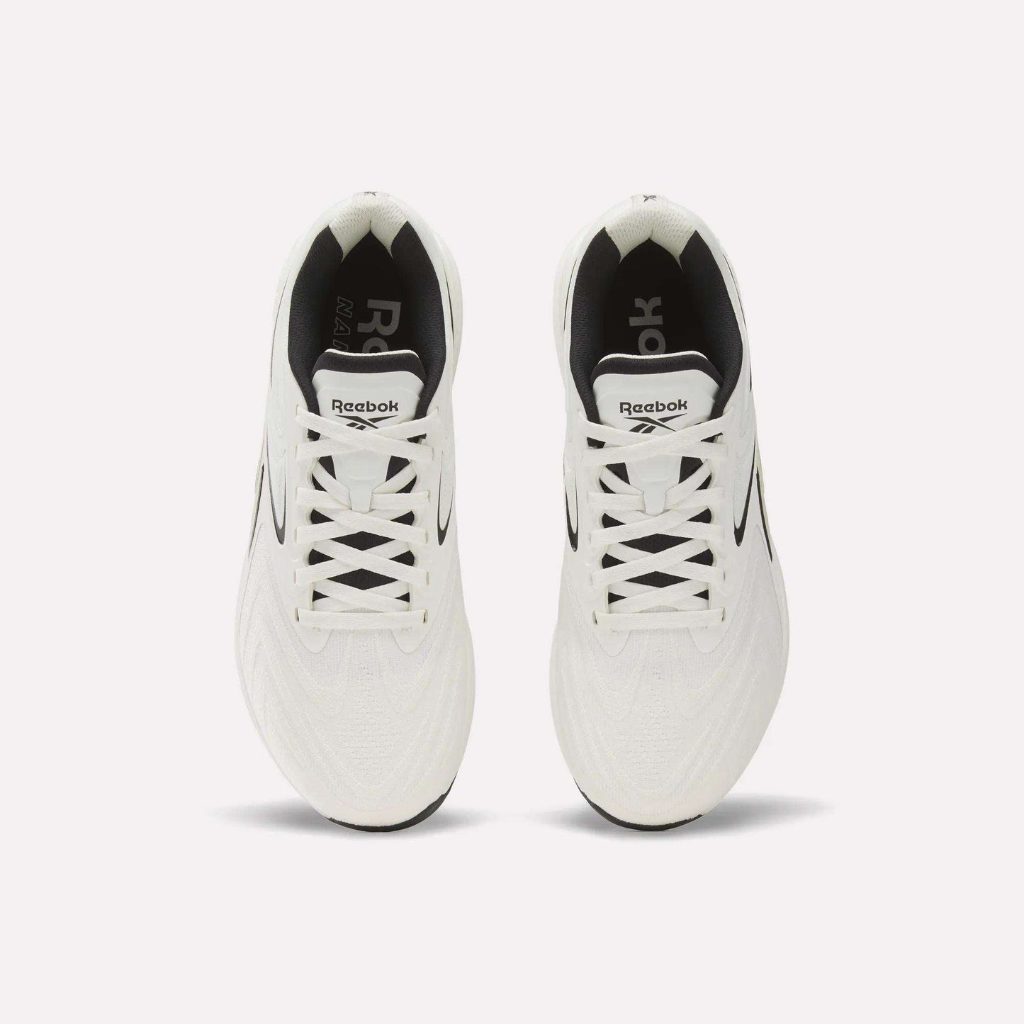 Top view of Reebok Nano X5 Edge Training Shoes in white with black accents and inner lining, neatly laced and side by side on a plain white background, highlighting performance and style.