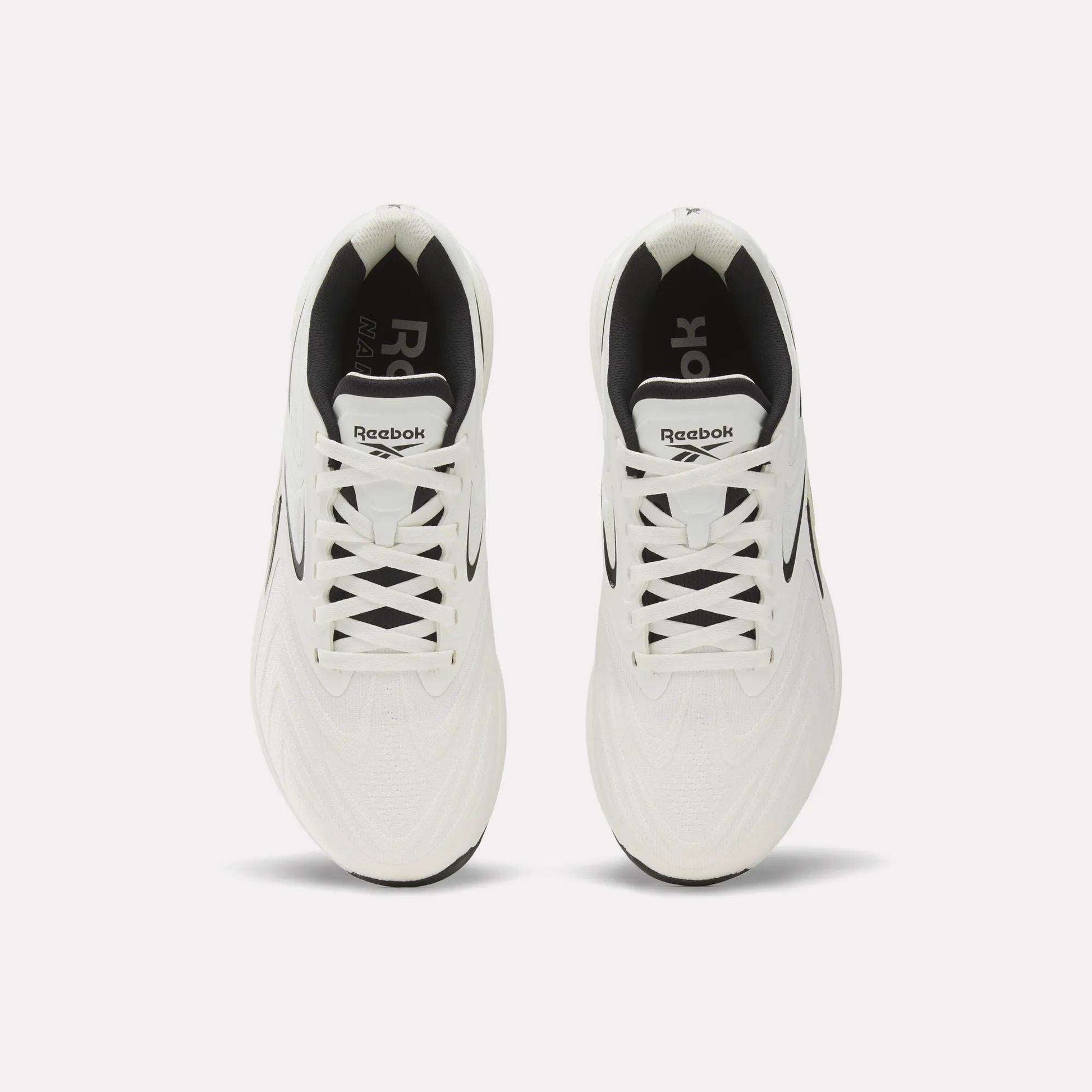Top view of Reebok Nano X5 Edge Training Shoes in white with black accents and inner lining, neatly laced and side by side on a plain white background, highlighting performance and style.