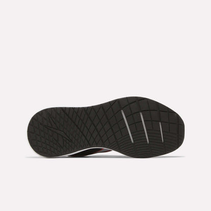 Showcased on a plain white background, the Women's Nanoflex 2.0 Training Shoes by Reebok feature a black sole with a textured diamond-pattern tread and three horizontal grooves near the toe—ideal for stylish and versatile women’s workouts.
