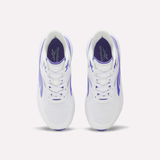 Top view of a pair of Reebok Women's Viva Speed Shoes featuring purple accents and Reebok logos on the insoles, placed side by side on a plain white background. These cushioned sneakers are crafted for comfort and style, making them perfect for active lifestyles.