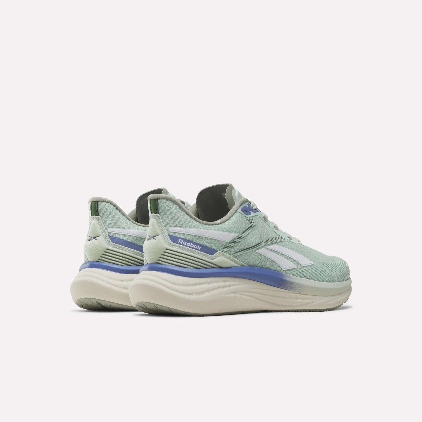 A pair of Women's Viva Speed Shoes by Reebok in light green with white soles, blue accents, and breathable mesh uppers, shown from the back and side angles against a plain white background.