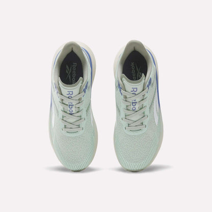 A top view of a pair of Women's Viva Speed Shoes by Reebok in mint green, featuring white soles and light blue accents, displayed on a plain light background. These breathable shoes are designed with a cushioned midsole for enhanced comfort and support.