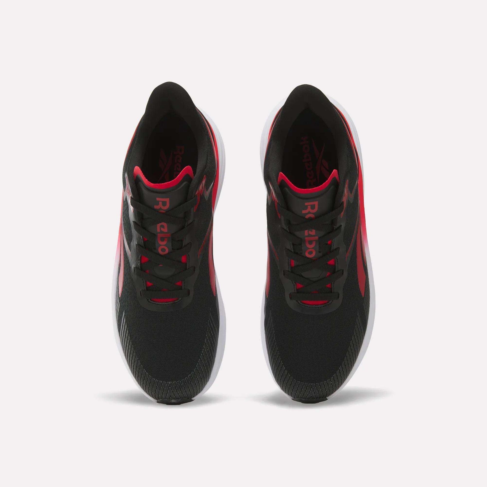 A pair of Men's Viva Speed Shoes by Reebok in black with red accents and white soles, designed as cushioned running shoes for maximum comfort, shown from above against a plain white background.