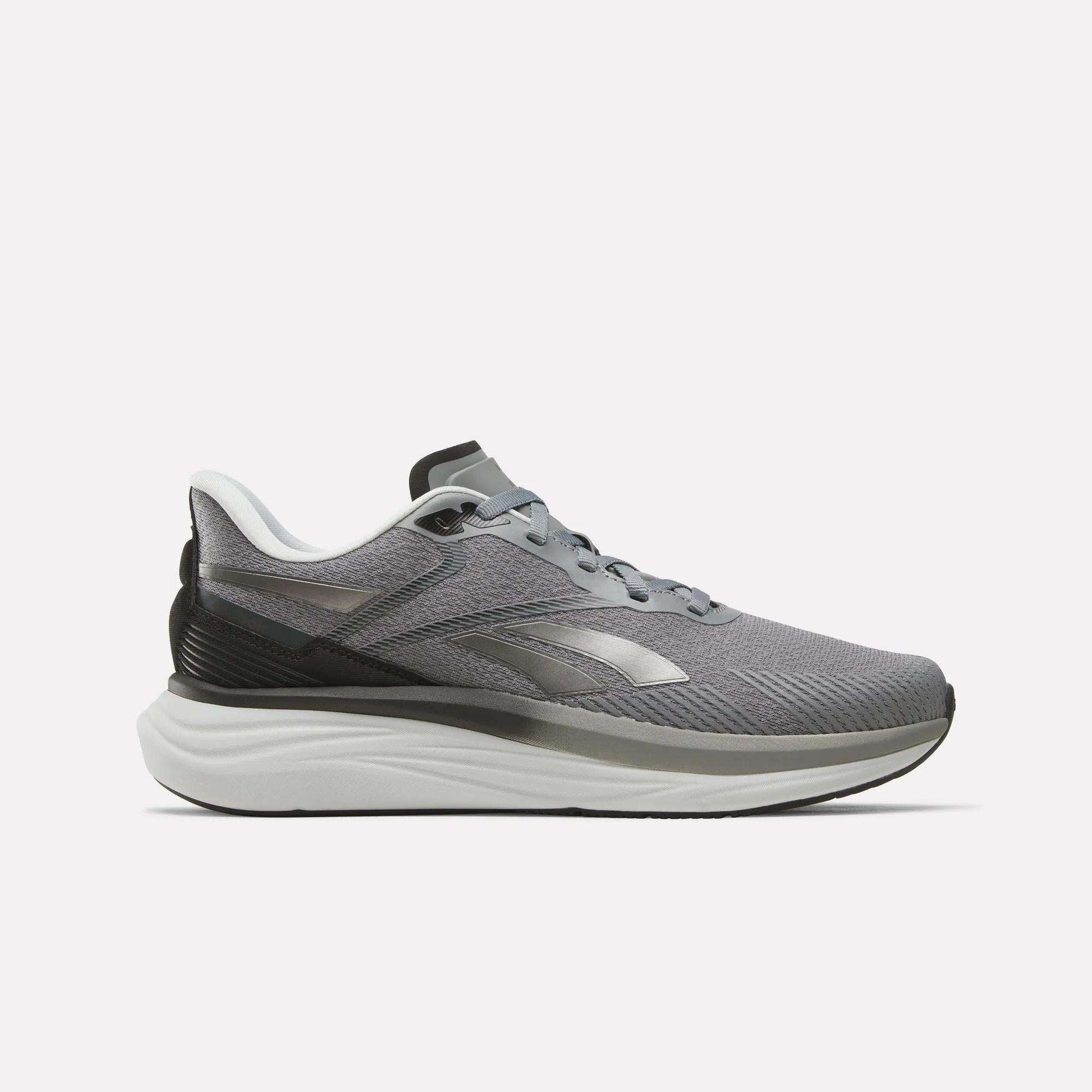 The Reebok Men's Viva Speed Shoes in Grey 4/Grey 5/Black feature a sleek athletic design with black and white accents, a cushioned white sole for enhanced comfort, and a convenient lace-up closure. These breathable men's running shoes are presented against a plain white background.