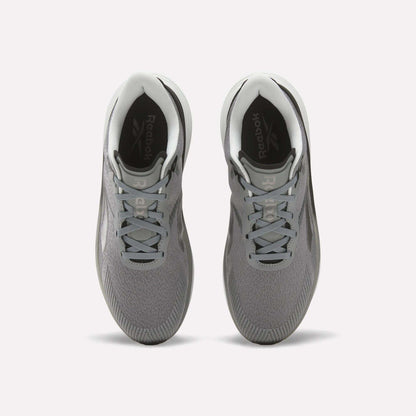 Top view of a pair of Reebok Men's Viva Speed Shoes in gray with white soles and light gray laces on a white background, featuring a breathable design and cushioned comfort for all-day wear.
