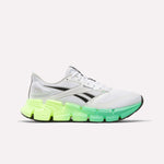 The Reebok Men's FloatZig 2 Running Shoes in White/Digital Lime/Black feature black accents, a chunky sole fading from neon yellow to green, and advanced Superfloat+ cushioning for superior comfort. Displayed on a white background.