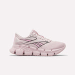 The Reebok Women's FloatZig 2 Running Shoes in Elemental Pink/Expressive Pink/Digital L feature a mesh upper, thick segmented Superfloat+ cushioned sole, dark accent lines, and a Reebok logo by the heel—ideal for springy runs.