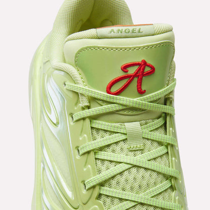 Close-up of a light green Reebok Angel Reese 1 Basketball Shoe with mesh, shiny details, green laces, and a red embroidered A and "ANGEL" on the tongue—highlighting its performance basketball shoe inspiration.