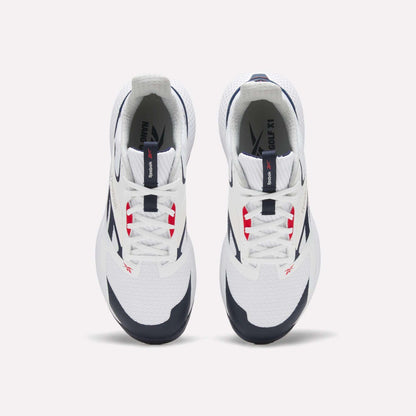 Top view of a pair of white Reebok Nano Golf Shoes with navy and red accents, white laces, black outsoles, and lightweight FlexWeave for comfort, positioned side by side on a plain light background.