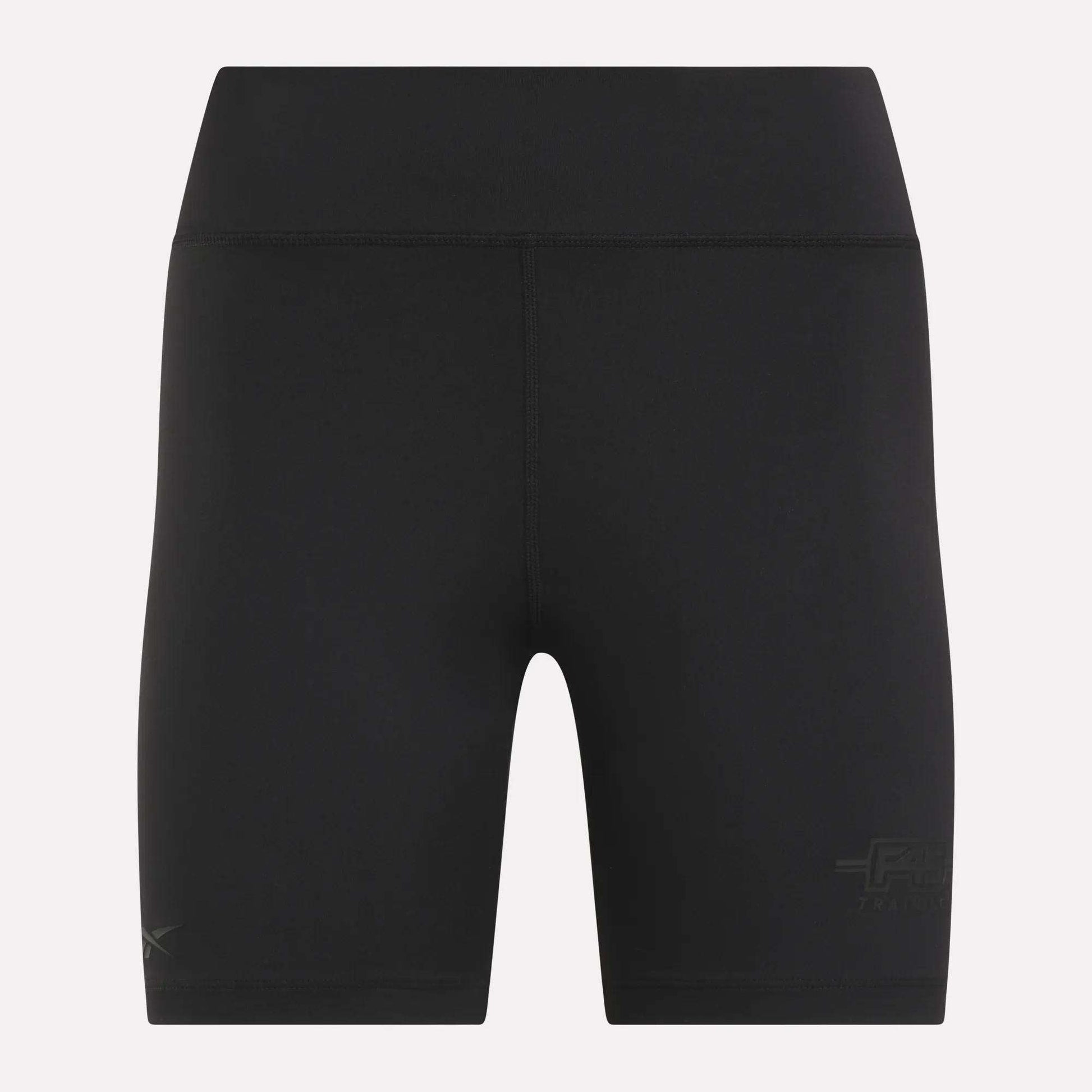 Women's Reebok x F45 Training High-Rise Biker Shorts, featuring a black, fitted design with subtle Reebok branding near the lower legs. Shown against a plain light background, these high-waisted shorts are crafted for performance without visible pockets or drawstrings—ideal for F45 Training and other high-intensity workouts.