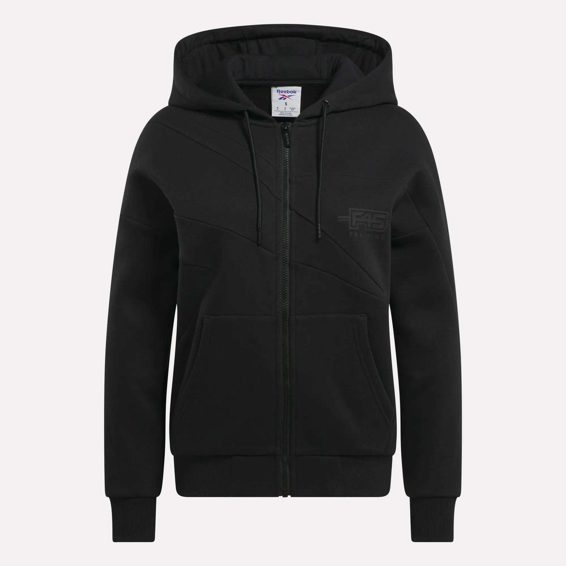 The Relaxed Reebok x F45 Women's Zip Hoodie features a hood, two front pockets, ribbed cuffs and hem, and a subtle logo on the left chest—ideal for Reebok performance or as an F45 hoodie.