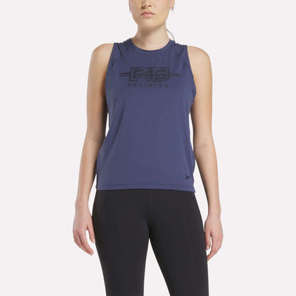 A woman wears the Women's Reebok x F45 Training Tank Top in navy and black leggings, standing facing forward against a plain white background.