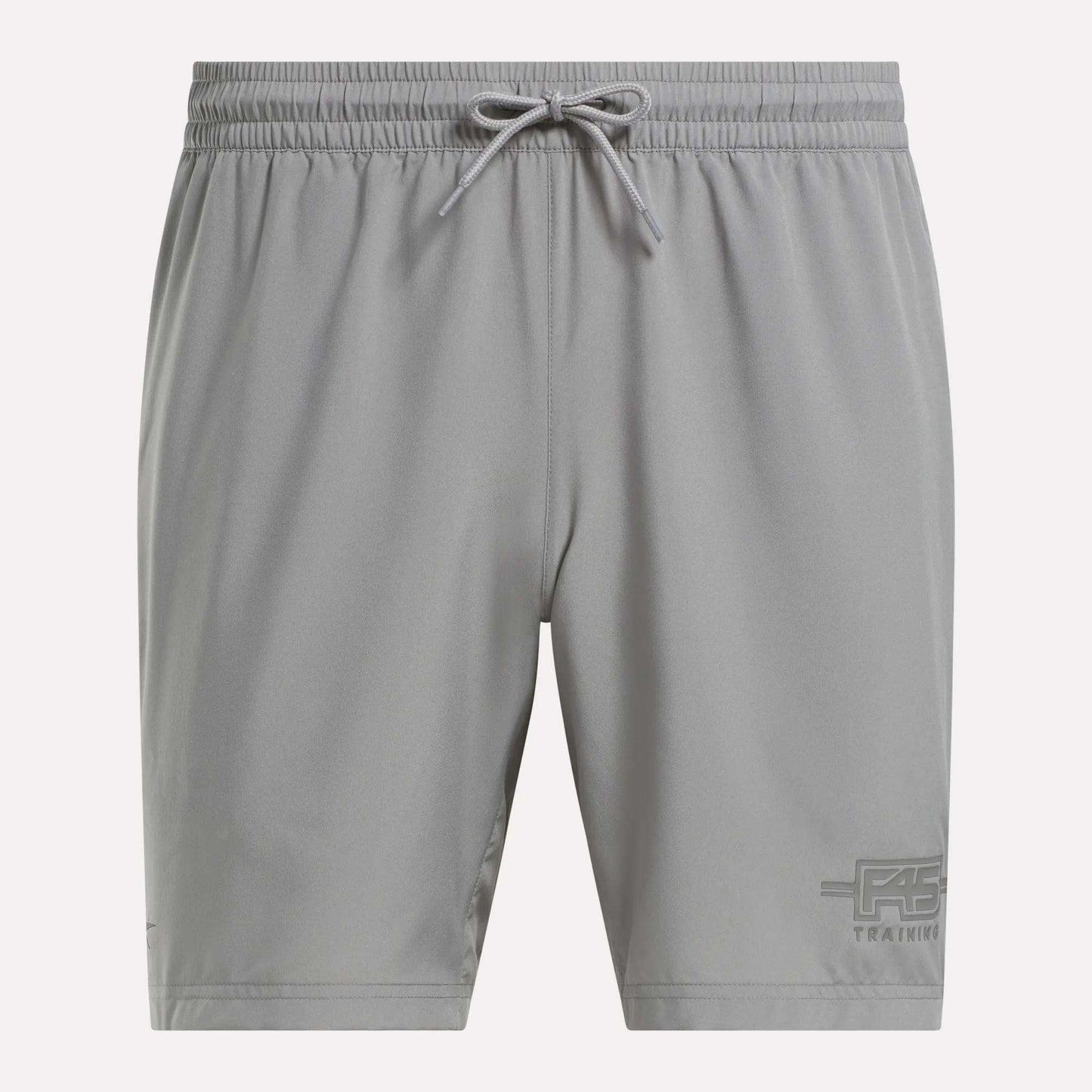 Men's Reebok x F45 Training Woven Shorts feature a gray design, elastic waistband with drawstring, and subtle logo. Lightweight fabric makes them perfect for F45 or high-intensity workouts.
