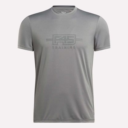 The Men’s Reebok x F45 Training T-Shirt by Reebok is a gray, short-sleeve men’s tee featuring “F45 Training” printed on the front in coordinating gray lettering, made with signature Reebok performance quality, and shown against a plain white background.