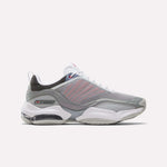 The Reebok DMX Series 3000 Shoes in Grey/White/Red feature mesh panels, white laces, a visible air-cushioned sole with DMX moving air technology for enhanced comfort, and subtle red accents. They are displayed on a plain white background.