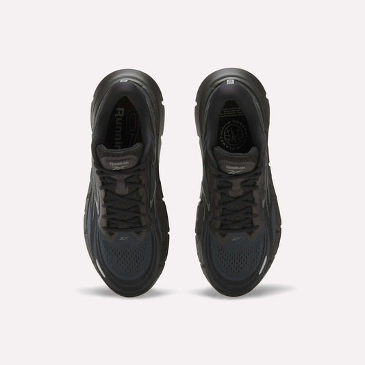 Top view of a pair of Reebok Men's FloatZig Double Running Shoes in black, featuring cushioned soles, dark laces, and mesh uppers, displayed side by side on a plain white background.