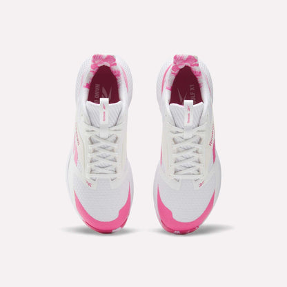 Top view of Reebok Nano Golf Shoes, featuring a white FlexWeave upper with pink branding accents. These lightweight performance golf shoes are shown side by side on a plain white background.