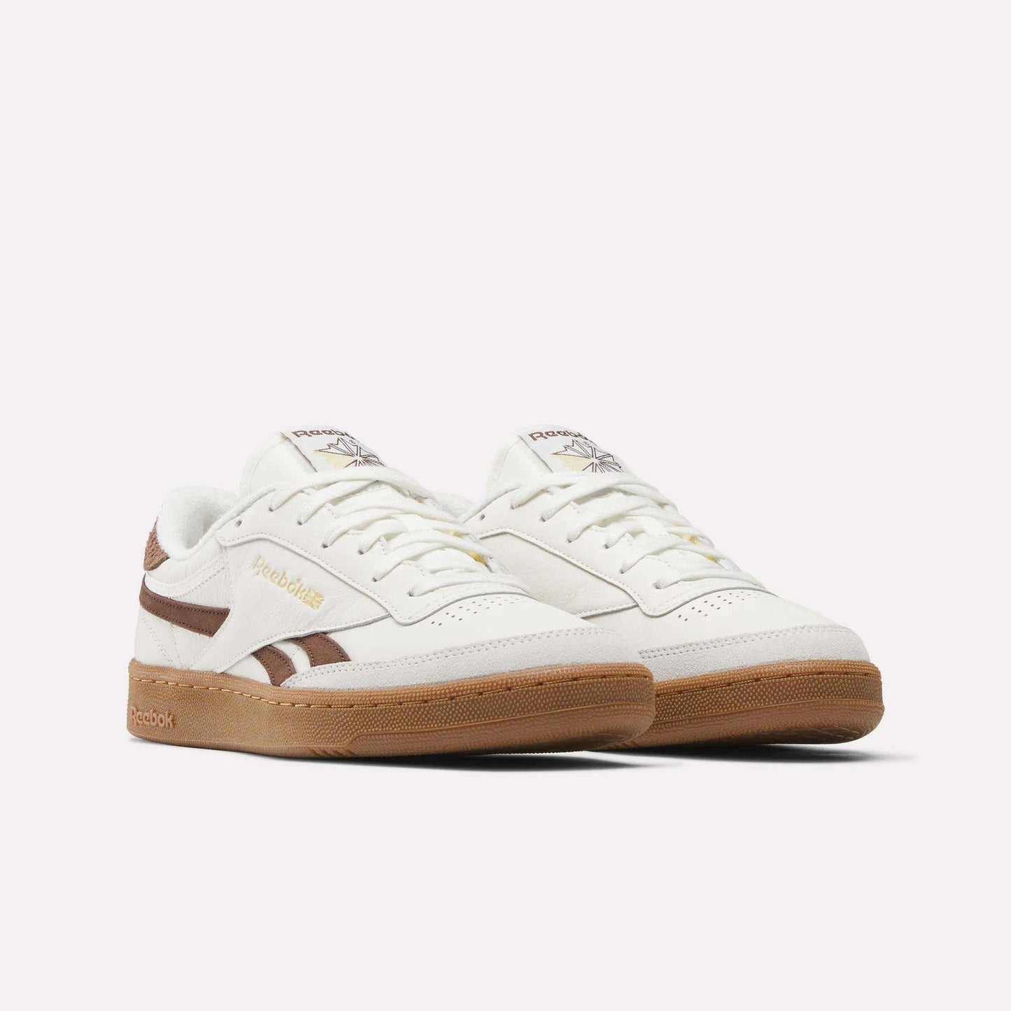 A pair of Reebok Men's Club C Revenge Vintage Shoes in white leather with brown accents and a gum sole, shown on a plain white background. The design features the Reebok logo on the side and tongue.